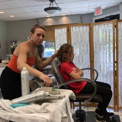 Strands Hair Salon - Meghan workin on my niece hair for my wedding