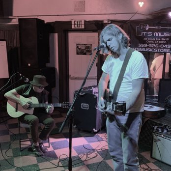 Intimo Cocktail Lounge - a man playing guitar and singing - Cocktail Bars Near Me - Fresno, California