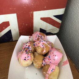 Doughnut holes with pink icing and sprinkles