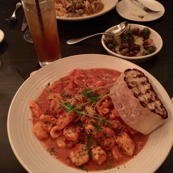 Cento - Seafood stew with a big piece of bread, warm olives, and an Arnold Palmer! - Italian Near Me - Madison, Wisconsin Cento - Seafood stew with a big piece of bread, warm olives, and an Arnold Palmer! - Italian Near Me - Madison, Wisconsin