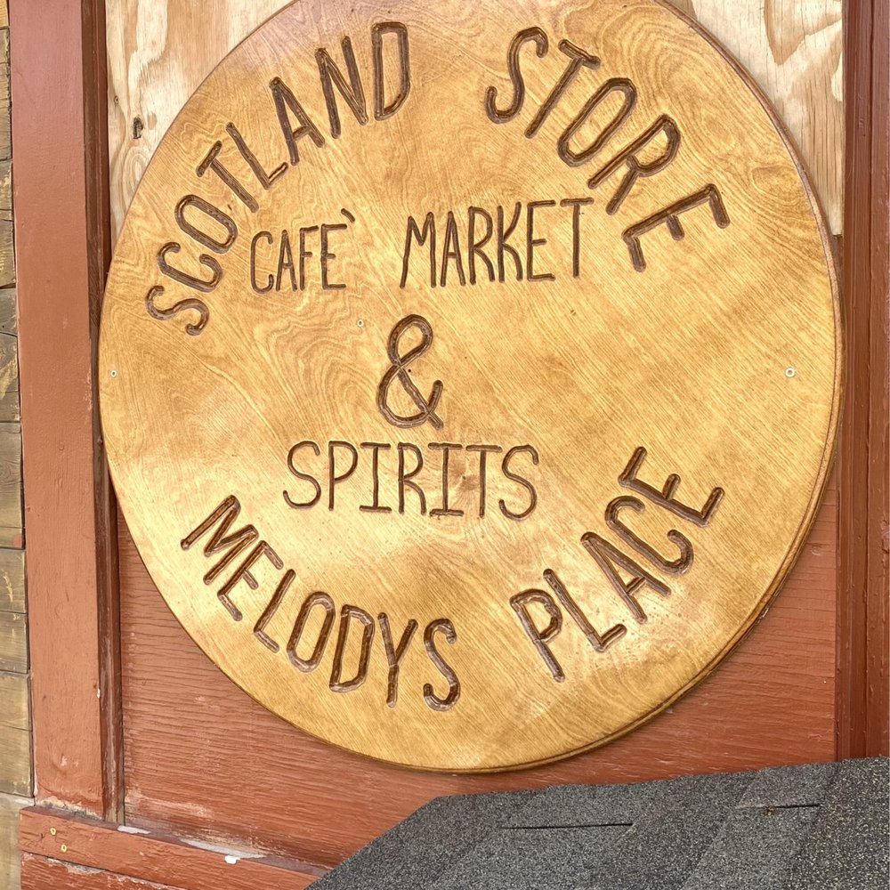 a wooden sign for a cafe a wooden sign for a cafe