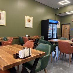 Gyro Spot - Inside. Fancy seating area - tables and leather chairs