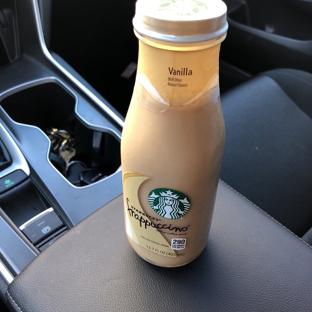 7-Eleven - a bottle of starbucks coffee sitting on the dashboard of a car - Convenience Stores Near Me - Stockton, California