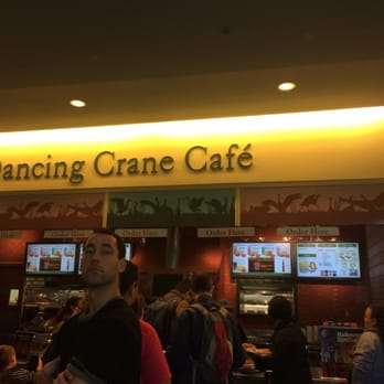 Dancing Crane Cafe - a man standing in front of the entrance - Fast Food Near Me - Bronx, New York
