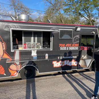 Taquizas Tacosteno - two people standing in front of a taco truck - Tacos Near Me - Maywood, Illinois Taquizas Tacosteno - two people standing in front of a taco truck - Tacos Near Me - Maywood, Illinois