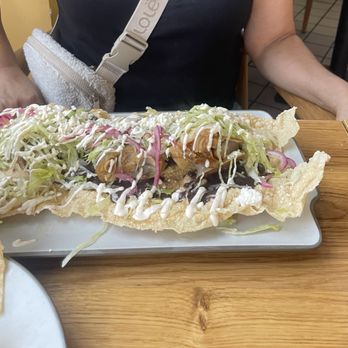 La Casa De La Abuela - Tostada de cueritos, whole pork piece served on top of tostada (bone in) - Mexican Near Me - South Gate, California La Casa De La Abuela - Tostada de cueritos, whole pork piece served on top of tostada (bone in) - Mexican Near Me - South Gate, California