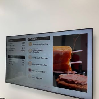 Crumbl - Tikahtnu Commons - a menu displayed on the wall - Bakeries Near Me - Anchorage, Alaska