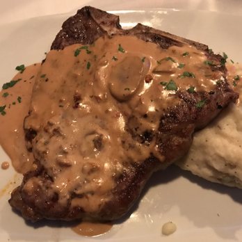 Gourmet Italia - 20 oz. bone-in Porterhouse steak with a porcini mushroom cream sauce, served over mashed potatoes. - Italian Near Me - Temecula, California Gourmet Italia - 20 oz. bone-in Porterhouse steak with a porcini mushroom cream sauce, served over mashed potatoes. - Italian Near Me - Temecula, California