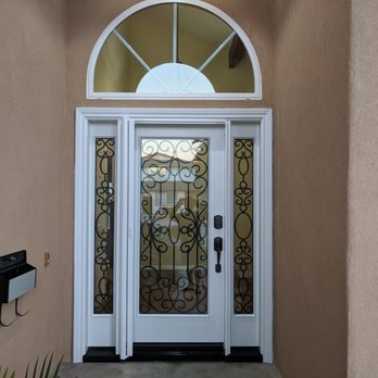 Today's Entry Doors - Jeld-Wen Aurora Custom Fiberglass with wrought iron inserted between clear glass on both sides. Model A5037. Decorative Grille = Heritage. - Door Sales/Installation Near Me - Orange, California