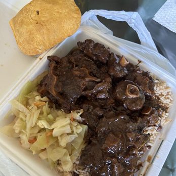 Love Bird Restaurant - Beef patty and oxtail entree - Caribbean Near Me - Sugar Land, Texas Love Bird Restaurant - Beef patty and oxtail entree - Caribbean Near Me - Sugar Land, Texas
