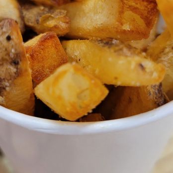 Five Guys - Cup filled with fries plus more in the bag - Burgers Near Me - Reston, Virginia