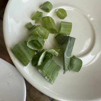 Seven Mile Cafe - There's no reason for this much green onion (and big slices) on top of my small bowl grits. - Breakfast & Brunch Near Me - Denton, Texas Seven Mile Cafe - There's no reason for this much green onion (and big slices) on top of my small bowl grits. - Breakfast & Brunch Near Me - Denton, Texas
