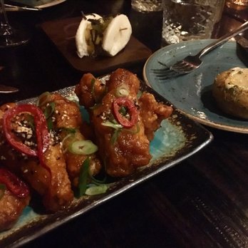 Cellar 335 - Maple Chipotle wings (left). Spicy cornbread (right). - Cocktail Bars Near Me - Jersey City, New Jersey