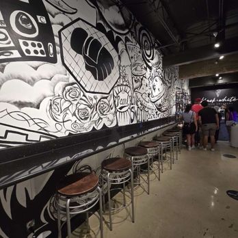 Black+White Modern Creamery - Seating leading up to ice cream counter (bathroom inside) - Ice Cream & Frozen Yogurt Near Me - San Antonio, Texas