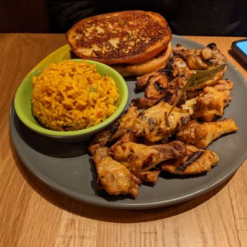 Nando's Peri-Peri - Wings with rice and garlic bread - Chicken Shop Near Me - Lanham, Maryland
