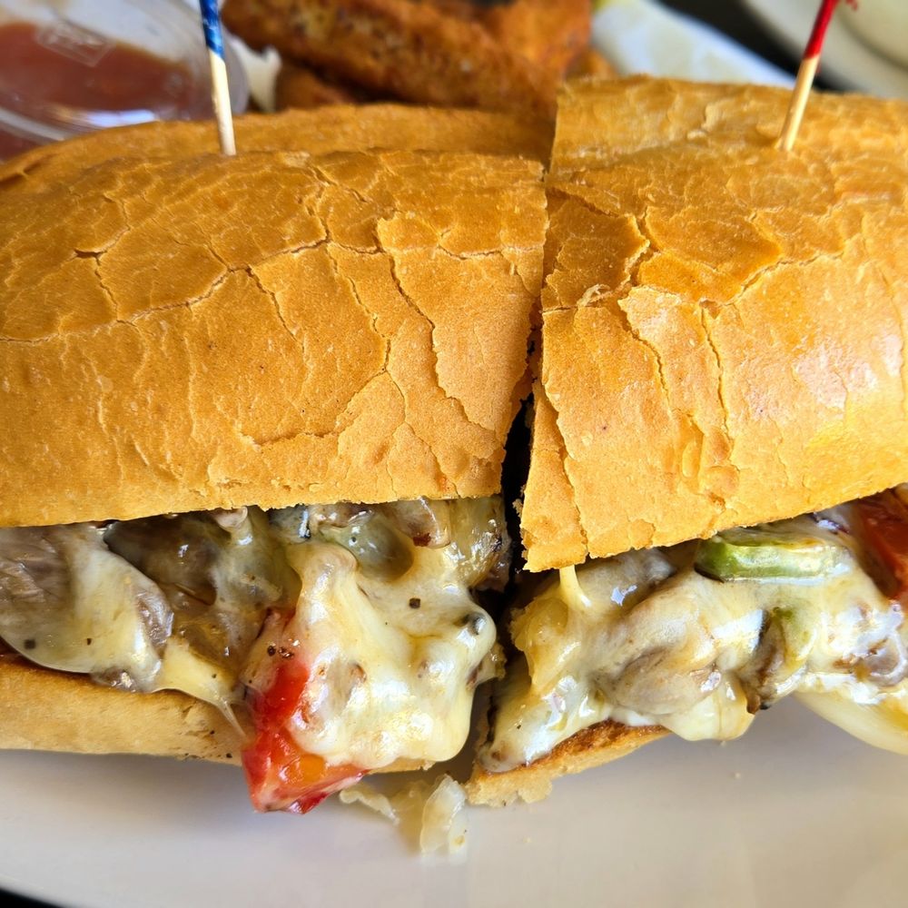 Meester Zebra - Philly Steak Sandwich. Tri-Tip steak, grilled onions, grilled bell peppers, mozzarella cheese on toasted deli roll. The best. - American Near Me - Cathedral City, California Meester Zebra - Philly Steak Sandwich. Tri-Tip steak, grilled onions, grilled bell peppers, mozzarella cheese on toasted deli roll. The best. - American Near Me - Cathedral City, California