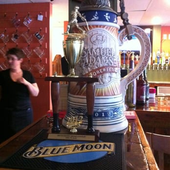 Springvale Publick House - a large beer mug on a bar - Pubs Near Me - Springvale, Maine