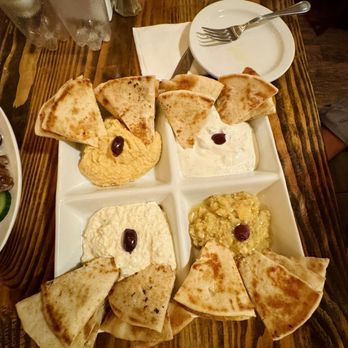 Greek Brothers Taverna - a tray of pita chips, hummus, and olives - Greek Near Me - Dresher, Pennsylvania