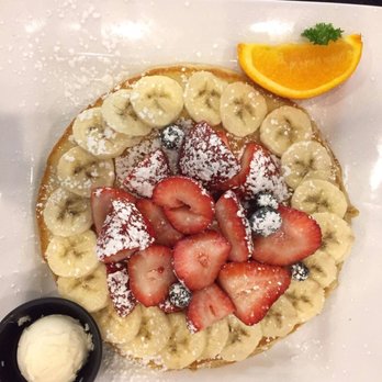 Keke's Breakfast Cafe - The Florida Pancake (topped with bananas, strawberries, and blueberries) - Breakfast & Brunch Near Me - Gainesville, Florida