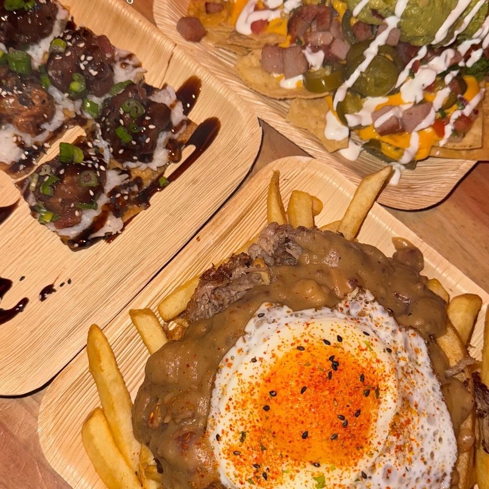 Stowaway - Poke bomb, spam spam nachos, stowaway fries - Tiki Bars Near Me - Tustin, California