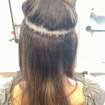 Roots & Rouge - Extensions were installed with a very crooked part, causing them to hang 2 inches lower on the right - Hair Salons Near Me - Campbell, California Roots & Rouge - Extensions were installed with a very crooked part, causing them to hang 2 inches lower on the right - Hair Salons Near Me - Campbell, California