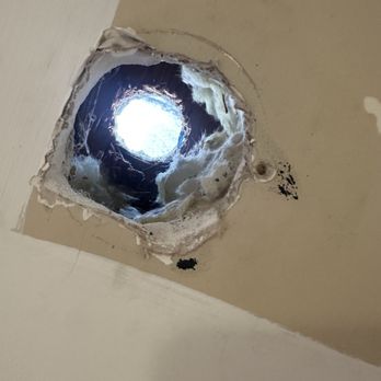 Barrios Handyman - Before the job hole up close - Painters Near Me