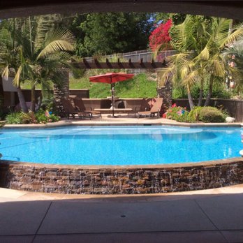 DJ's Clearwater Pools - a pool with a waterfall - General Contractors Near Me - Riverside, California
