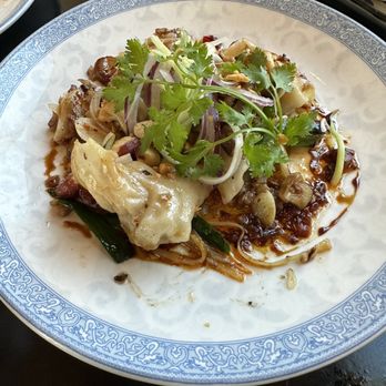 LSXO - Pork shrimp, & crab dumplings, spicy black vin dressing, chives, spinach, peanuts - Vietnamese Near Me - Huntington Beach, California