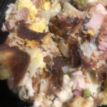 Broken Yolk Cafe - Meat Lover's Skillet. Burned potatoes and bacon. Sausage was a little easier to identify because it was thicker. - American Near Me - Glendora, California