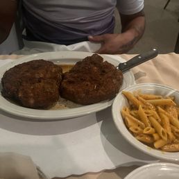 Pork chops Milanese with a side of vodka sauce penne Pork chops Milanese with a side of vodka sauce penne