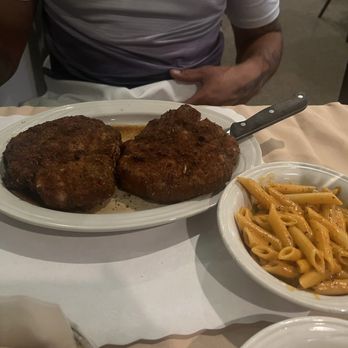 Vito's Ristorante - Pork chops Milanese with a side of vodka sauce penne - Italian Near Me - East Syracuse, New York Vito's Ristorante - Pork chops Milanese with a side of vodka sauce penne - Italian Near Me - East Syracuse, New York