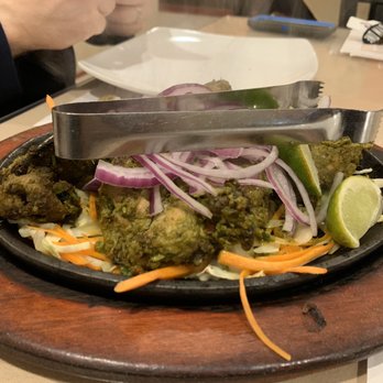 Biryani Pot - The Hariyali Chicken Kebab. "Chicken marinated with fresh green herbs, served with grilled onion and salad" - Indian Near Me - Austin, Texas