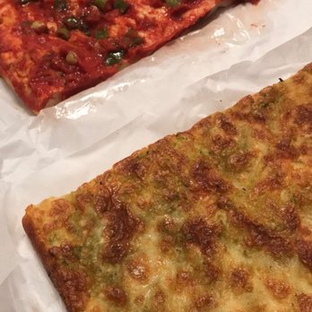 Liguria Bakery - Pizza (sauce and onions) focaccia in the back, pesto (pesto and cheese) focaccia in the front - Bakeries Near Me - San Francisco, California Liguria Bakery - Pizza (sauce and onions) focaccia in the back, pesto (pesto and cheese) focaccia in the front - Bakeries Near Me - San Francisco, California