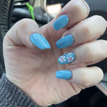 Happiest Nails & Spa - Example of simple nails with a flower detail. My nails are always even in length and shape. Ken is great! - Nail Salons Near Me - Oceanside, California