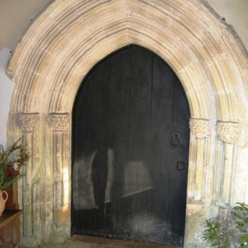 St Michael's Church - St Michael's Church, Amberley - south doorway with 14th century oak-leaf decoration on capitals - Churches Near Me - Arundel, WSX