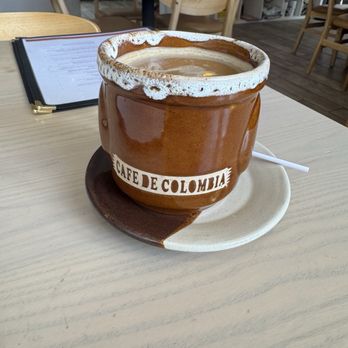 Pochis Sweet Designs - Columbian coffee with creamer. Mug & bags of coffee are available for purchase. - Cafes Near Me - Grand Rapids, Michigan