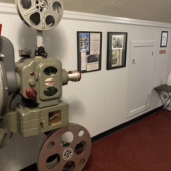 The Clayton Theatre - Vintage movie equipment and posters in the balcony. - Cinema Near Me - Dagsboro, Delaware The Clayton Theatre - Vintage movie equipment and posters in the balcony. - Cinema Near Me - Dagsboro, Delaware