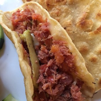 ConiSeafood - A sliver of avocado inside the Marlin tacos. - Mexican Near Me - Inglewood, California