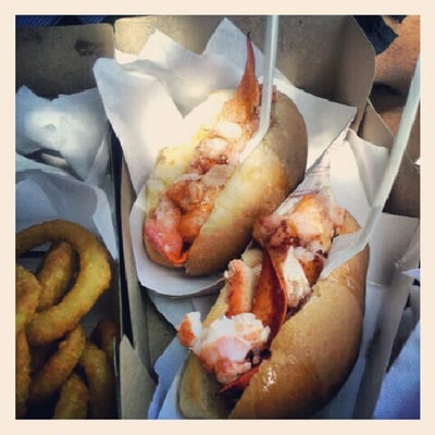 Photo of The Red Shack - Provincetown, MA, US. Two lobster rolls, Connecticut-style (melted better and toasted bun only), great breaded onion rings, and their signature spicy