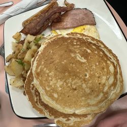 Beachwood Corner Cafe - Called the high tide, 2 bacon, 2 sausage, ham, 2 eggs and 2 pancakes. Tons of food for a steal of a deal.