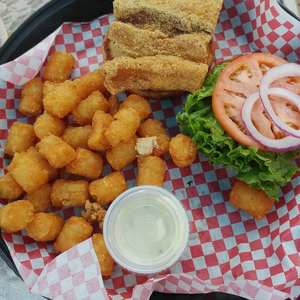 Tides Beach Bar & Grille - Fish sandwich - Tiki Bars Near Me - Jacksonville Beach, Florida Tides Beach Bar & Grille - Fish sandwich - Tiki Bars Near Me - Jacksonville Beach, Florida