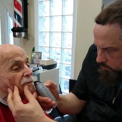 Gus's Barbershop - Taking care of the elderly community making sure every strand of hair is groomed and finished off with a hot towel lather shave