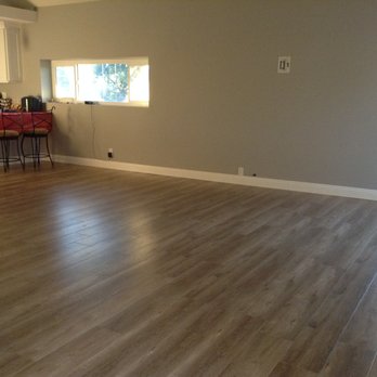 Only Solutions Cabinet Installers - New laminate floor that went in before he completed the kitchen - Cabinetry Near Me Only Solutions Cabinet Installers - New laminate floor that went in before he completed the kitchen - Cabinetry Near Me