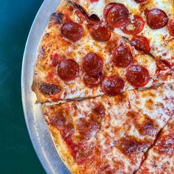 Loiee G's - 14" half-cheese/half-pepperoni pizza.