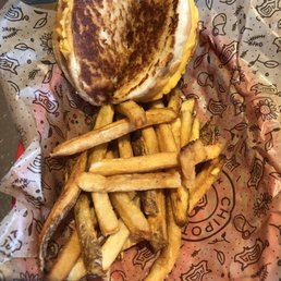 a sandwich and french fries in a basket