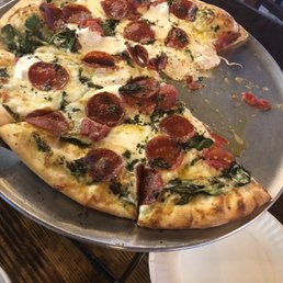 Pesto pizza with pepperoni. Pesto pizza with pepperoni.