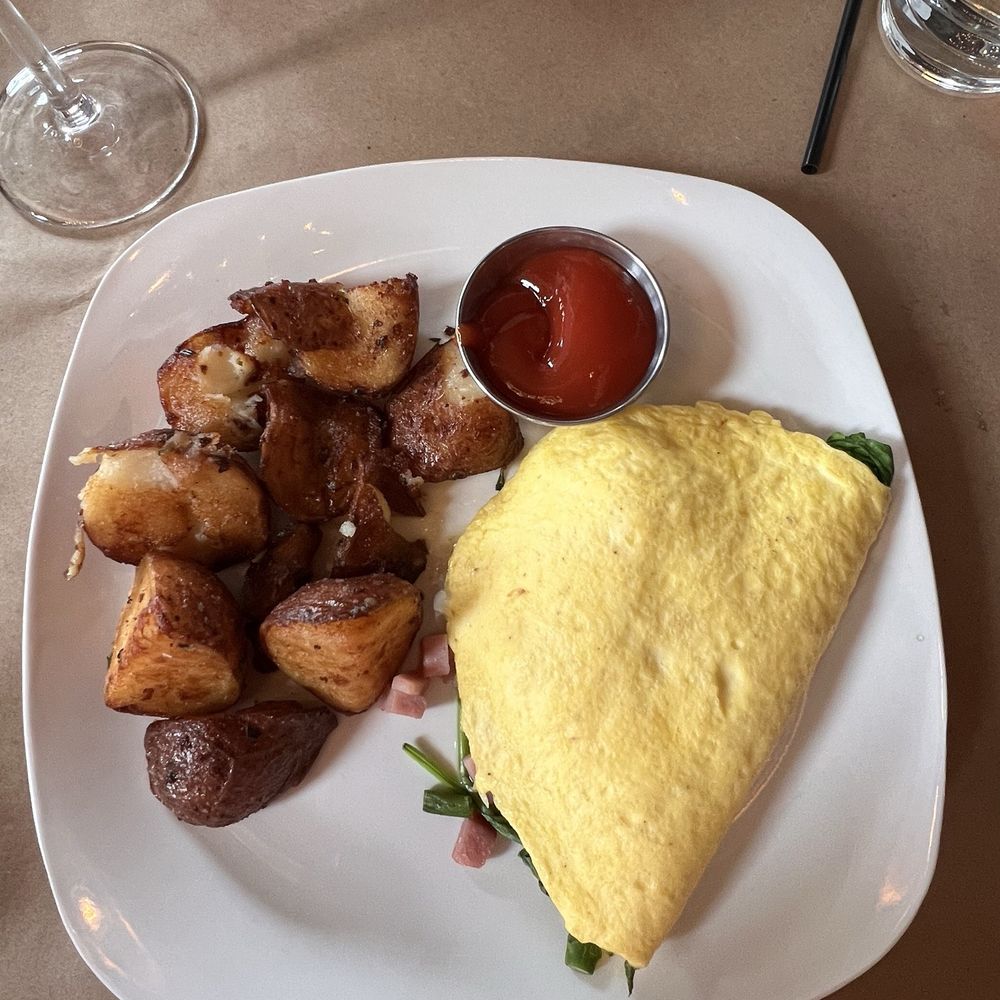 Pumpernickels - Spring omelette with ham, asparagus, fresh spinach, onions and Swiss cheese. I couldn't get enough of those home fries! - American Near Me - Saugatuck, Michigan