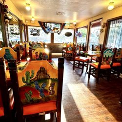 El Rancho Grande - Inside the restaurant w costumed hand painted chairs & tables. Always clean.