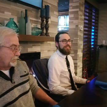 Blue Spruce Lounge - two men sitting at a table - Bars Near Me - Liverpool, New York Blue Spruce Lounge - two men sitting at a table - Bars Near Me - Liverpool, New York