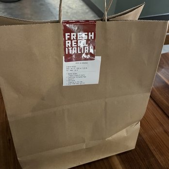 Due' Cucina - Roosevelt - To go bag sealed with a cool sticker - Italian Near Me - Seattle, Washington